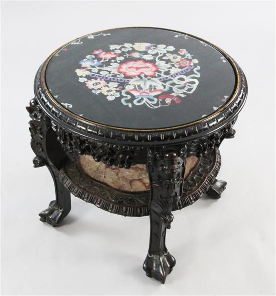 A Chinese carved rosewood circular two tier occasional table or urn stand, W.2ft 1in.
